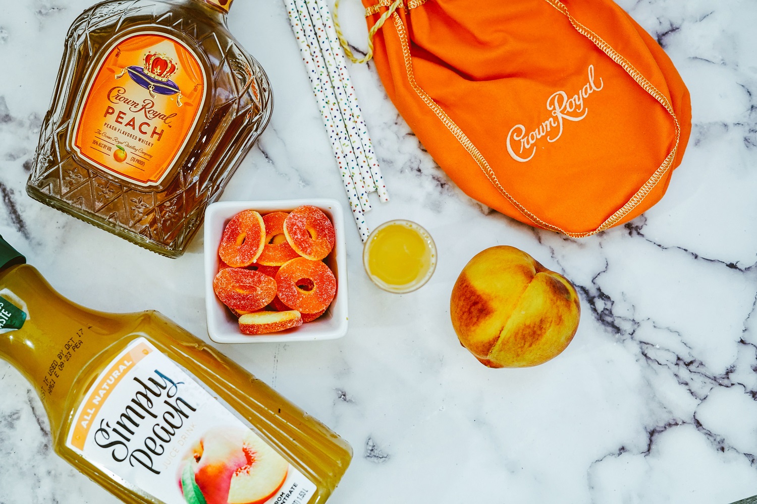 Ingredients for making Crown Royal Peach Whisky shooters.
