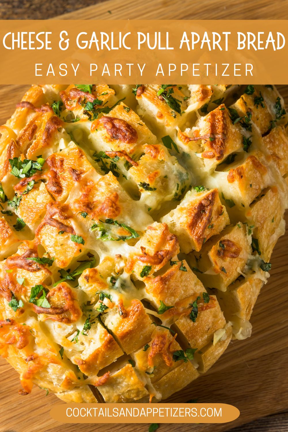 Cheese garlic pull apart bread sits on a wooden tray.