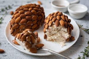 Pine Cone Cheese Ball with serving spoon on a plate