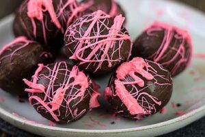 Amaretto Chocolates with pink drizzle on a plate