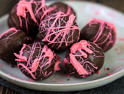 Amaretto Chocolates with pink drizzle on a plate