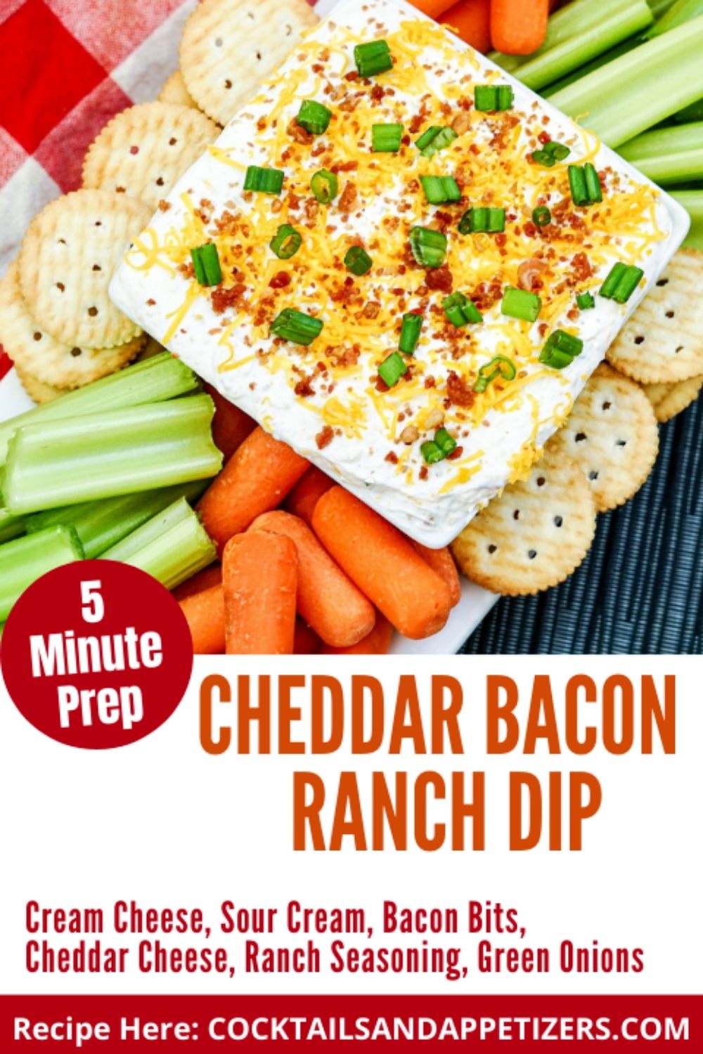 cheddar bacon ranch dip in a bowl with crackers and vegetables around it