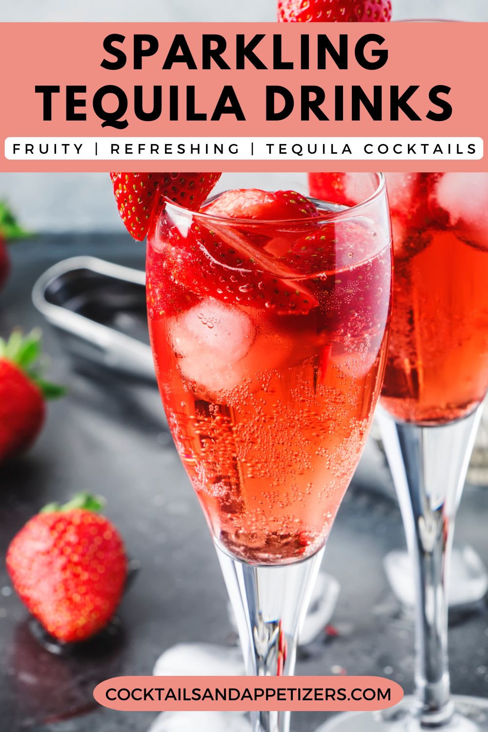 Two Tequila kiss cocktails in champagne flutes. Berry slices for garnish