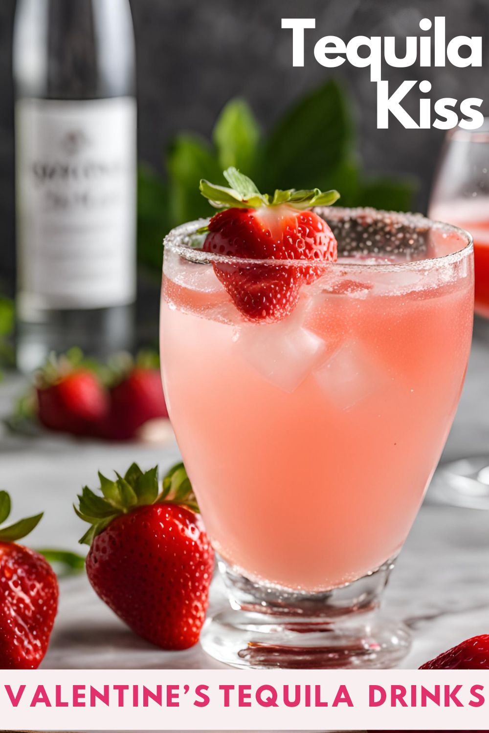 A pink tequila kiss drink in a highball glass with ice and a strawberry garnish.