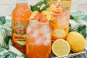 Spiked Southern Peach Lemonade in a glass with peach rings