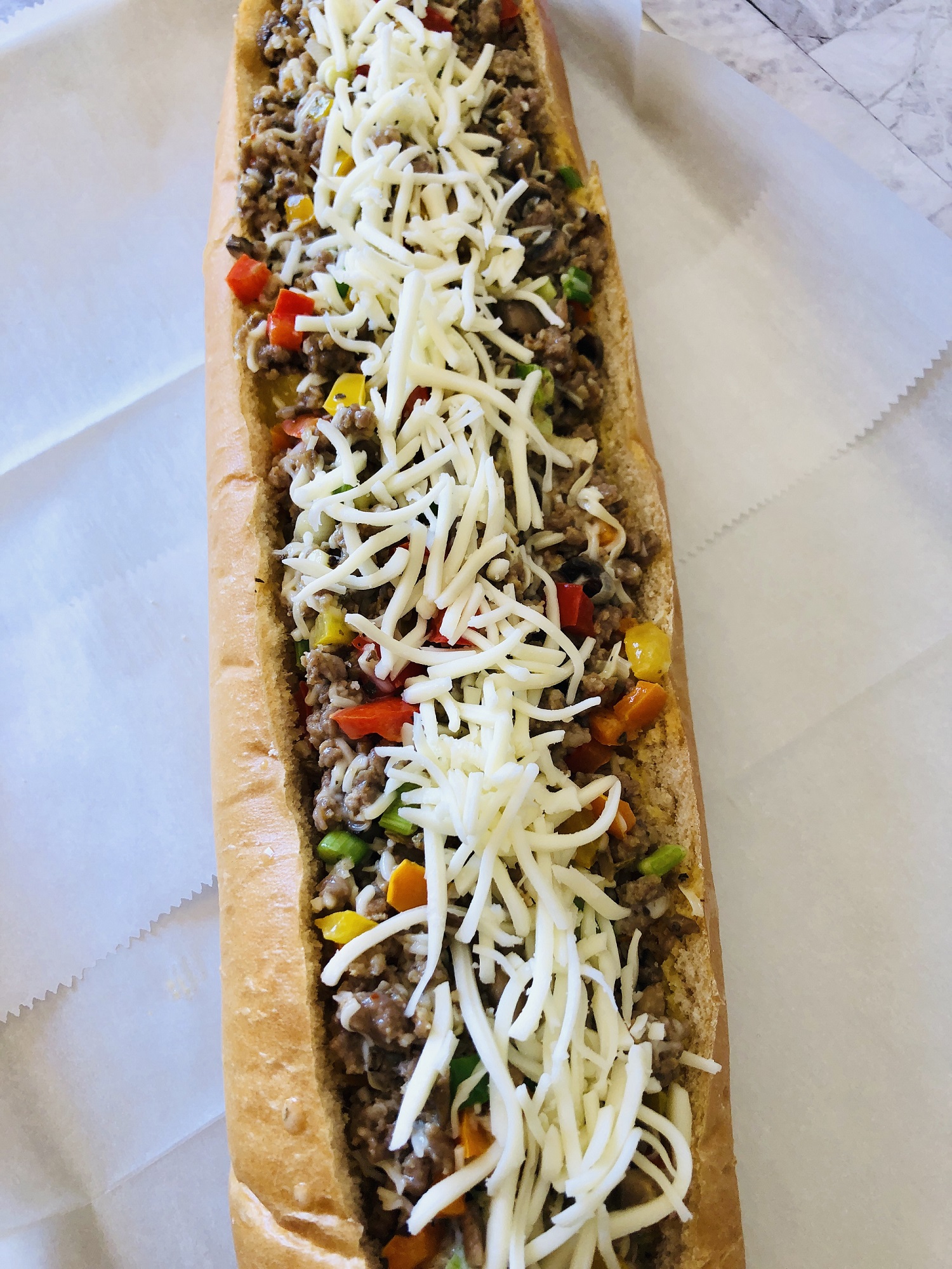 A baguette filled with Italian sausage mixture.