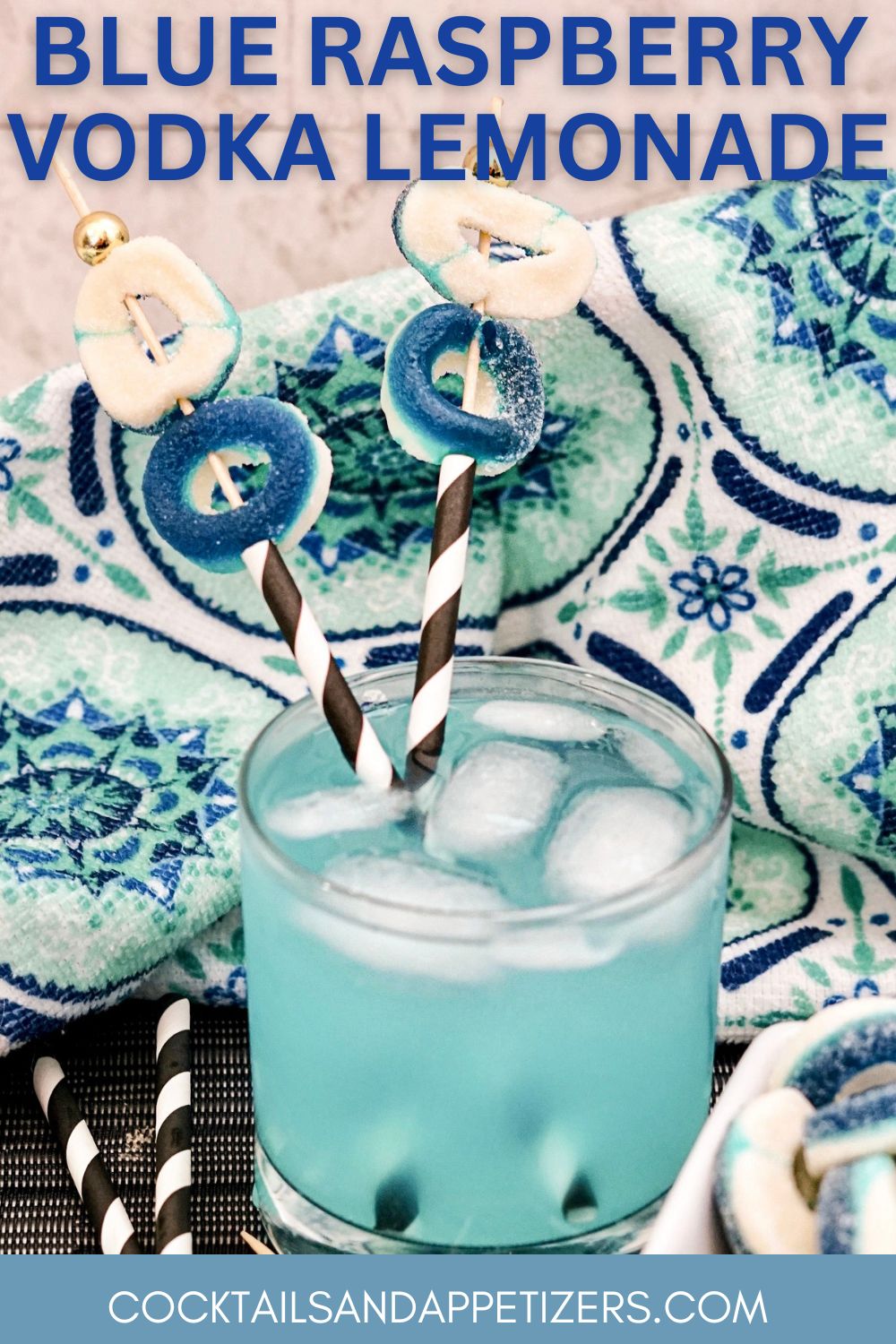 Blue Raspberry Lemonade Vodka drink with straws and gummy ring candy garnish.
