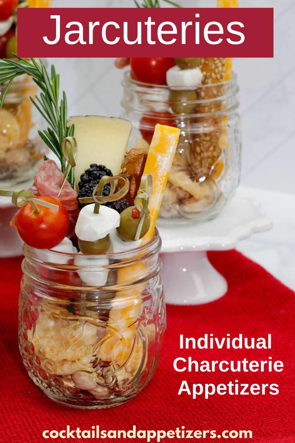 Charcuterie in small mason jars on a table