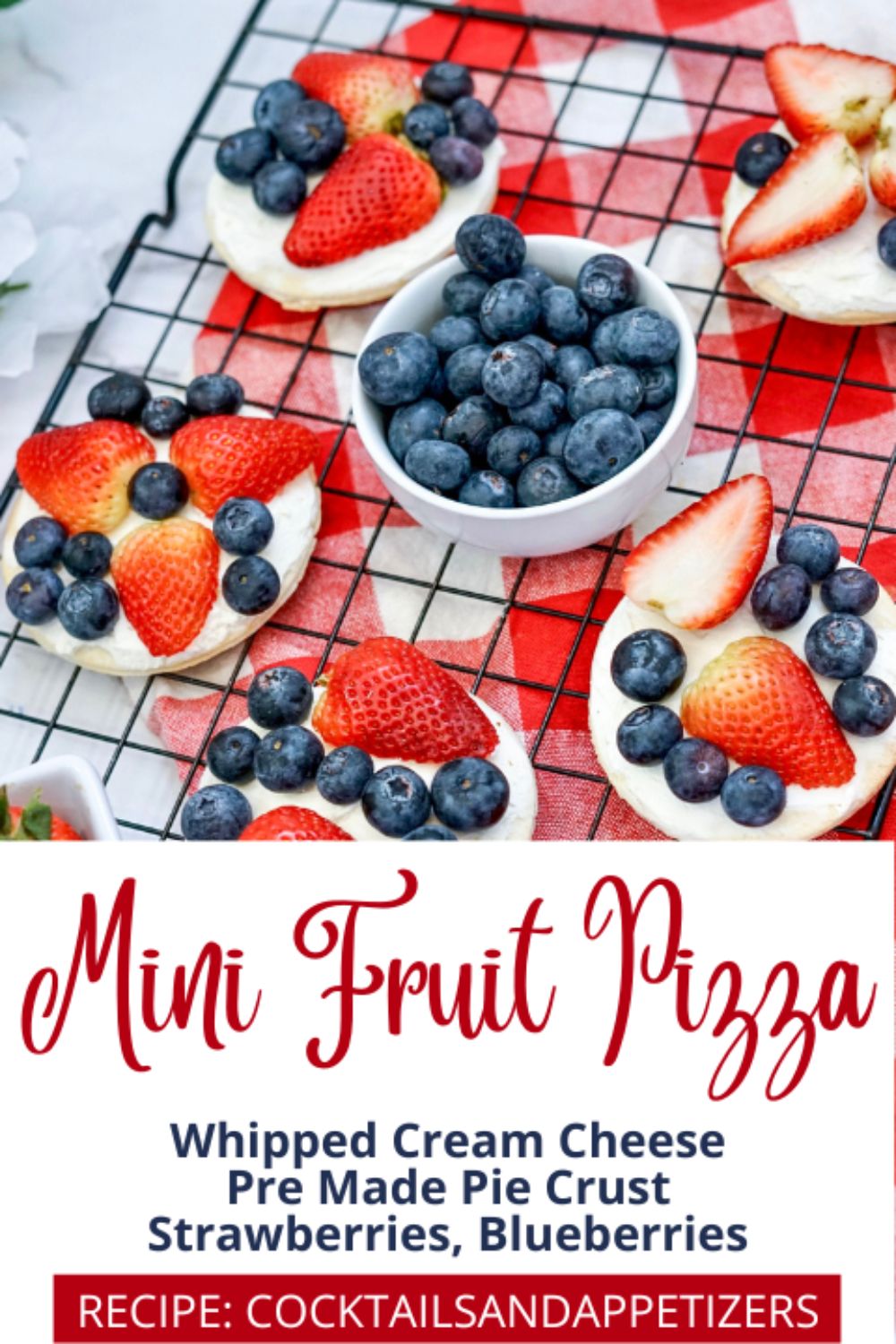 Mini fruit tarts with blueberries and strawberries and cream cheese