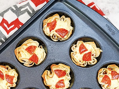 pizza wonton cups in a muffin tin