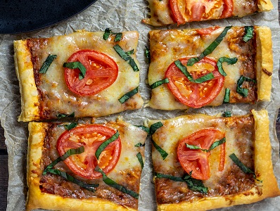 Margherita Pizza with Puff Pastry on parchment paper