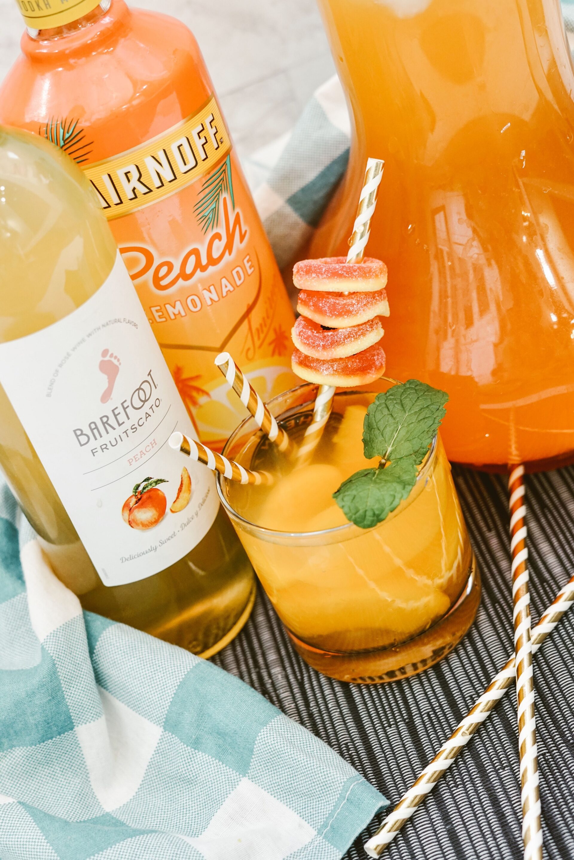 peach sangria on a table with ingredients.