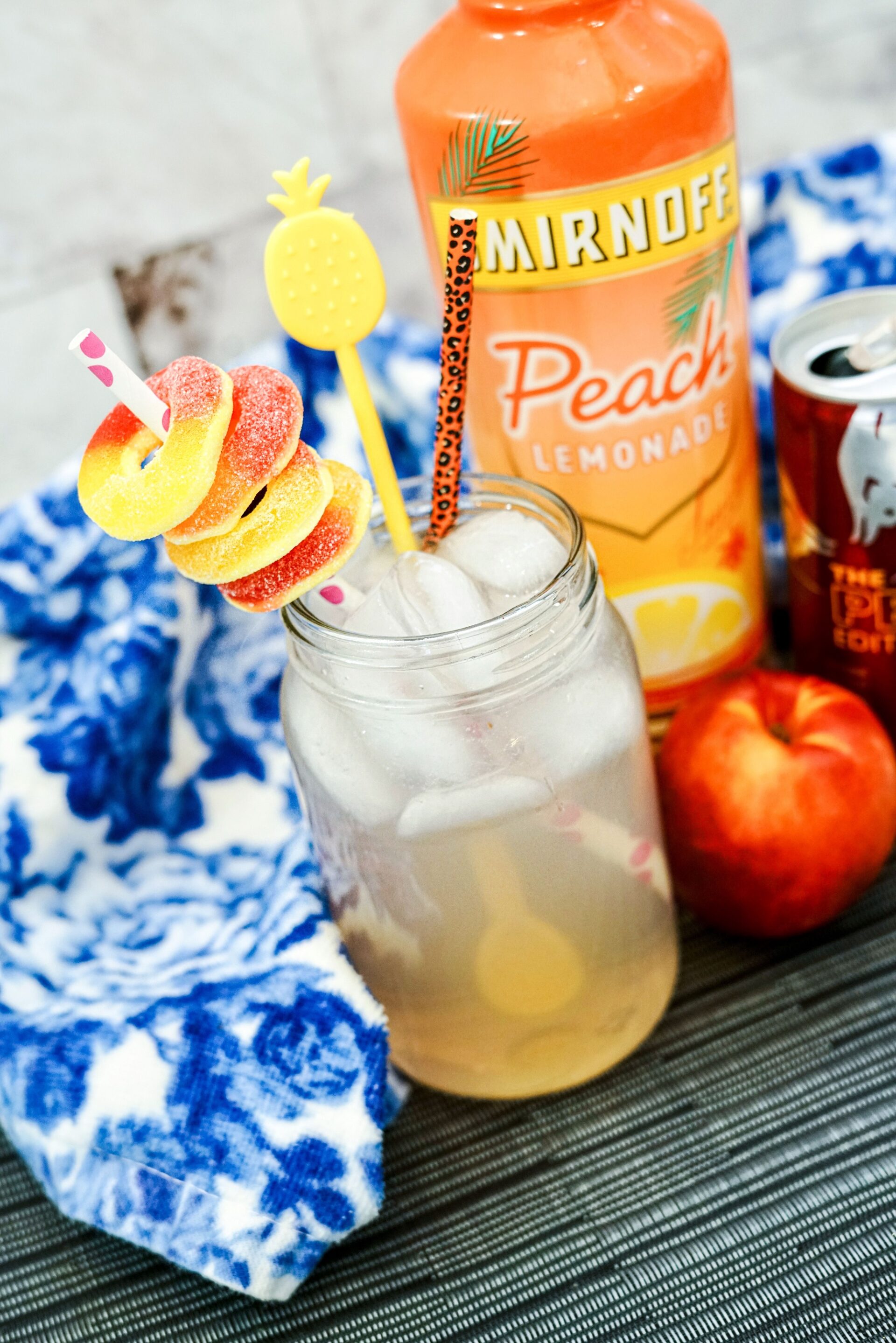 peach lemonade red bull on a counter with ingredients.