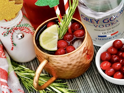 Cranberry Moscow Mule Holiday Cocktail with cranberry garnish