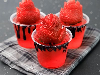 Red Halloween Jello Shot with strawberry garnish