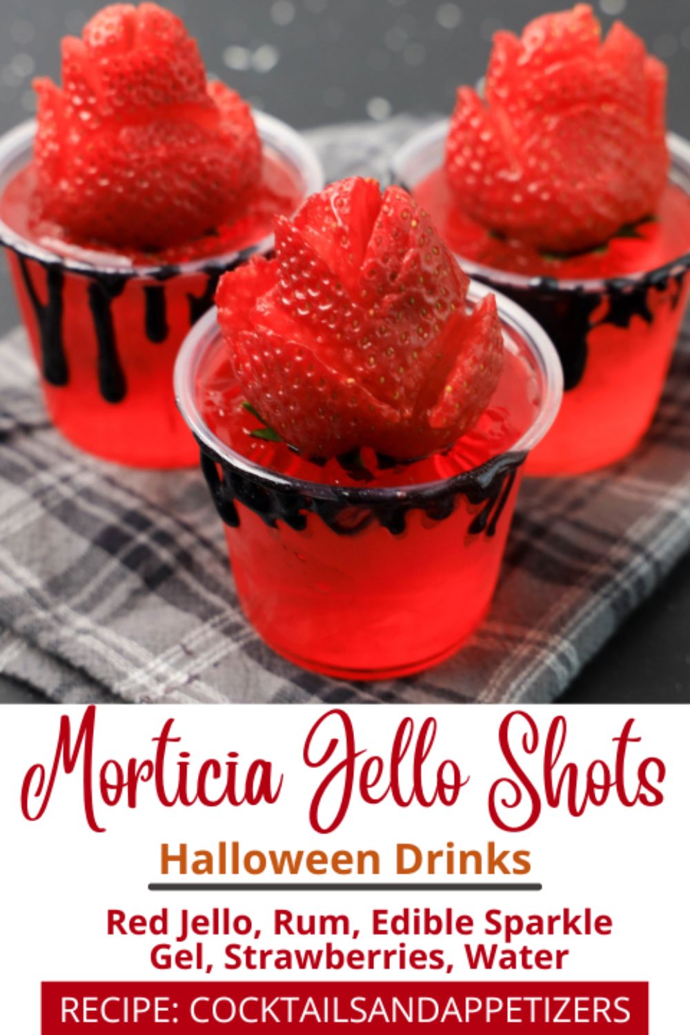 Halloween Jello Shot Morticia with a strawberry in a shot cup