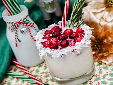 Rum Coconut Milk Cocktail with cranberry garnish