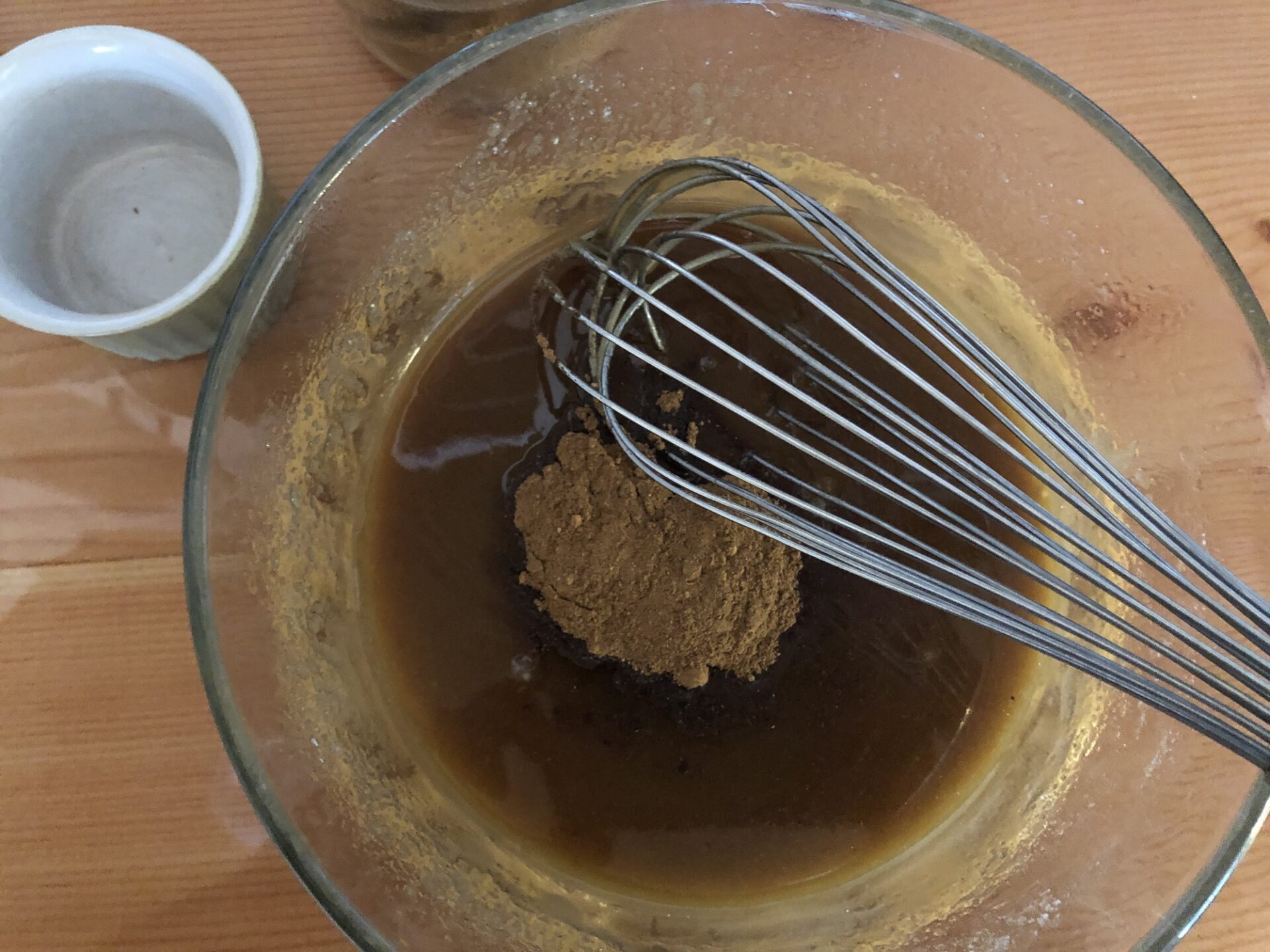 Whisking spices into melted butter and brown sugar.