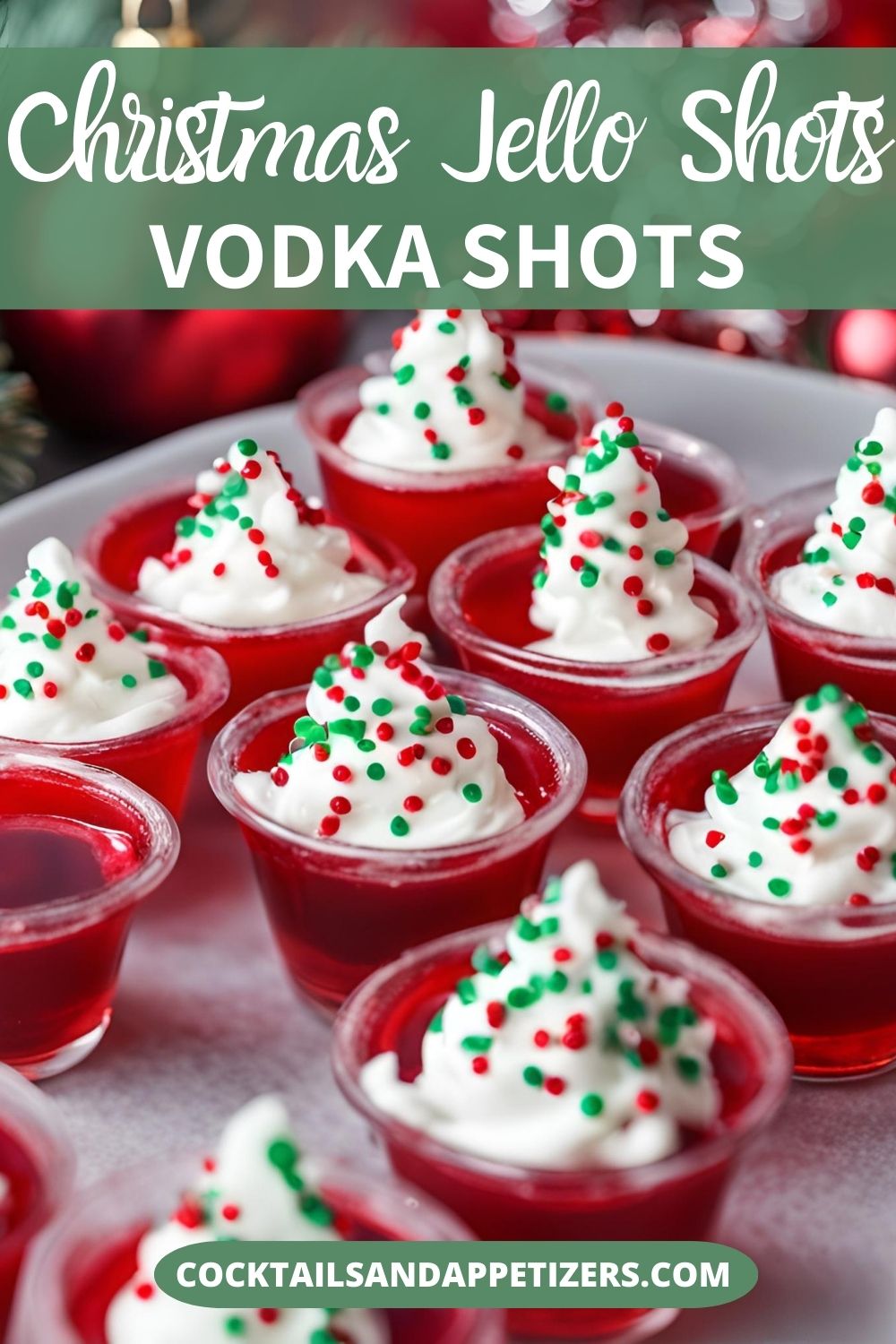 A tray of red jello shots garnished with whipped cream and sprinkles.