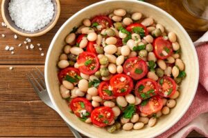 Cannellini Bean Salad in a bowl on wood table