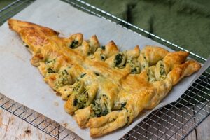 Christmas Tree Spinach Dip Breadsticks Appetizer on a cooling rack.