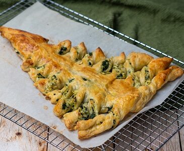 Christmas Tree Spinach Dip Breadsticks Appetizer on a cooling rack.
