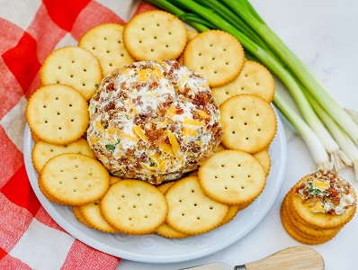 Bacon Ranch Cheese Ball on plate with crackers