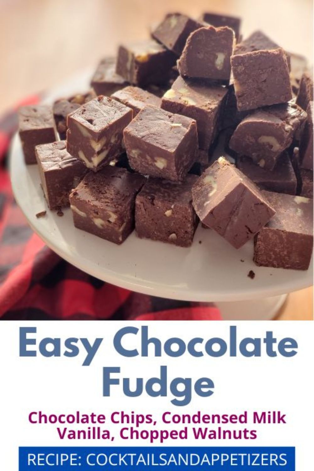 Easy Chocolate Fudge cut in squares sitting on a white plate.
