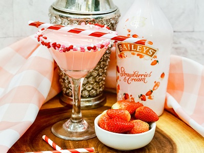 Baileys Strawberries and Cream Martini with a frosted candy rim.