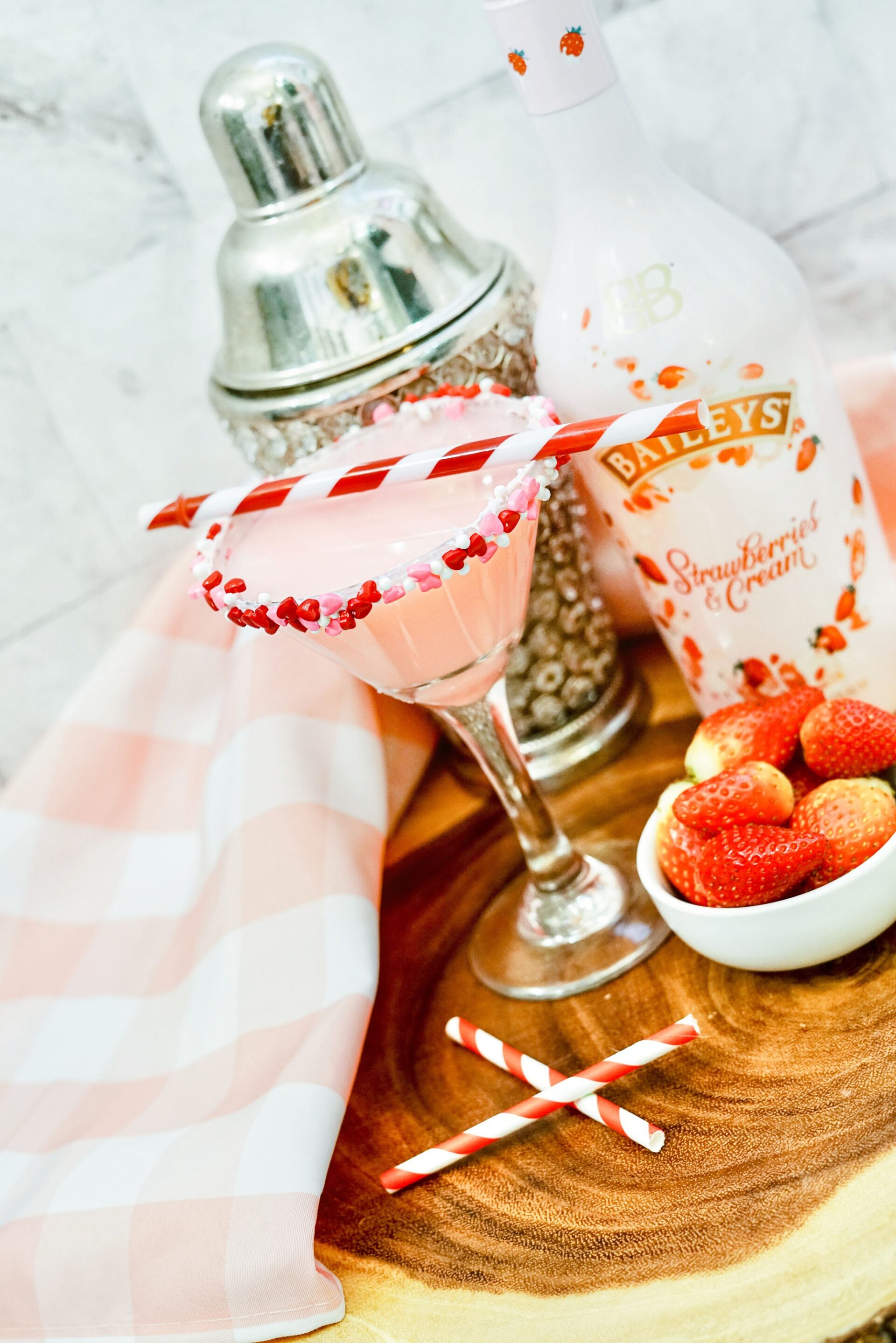 Baileys strawberries and cream martini on a counter.