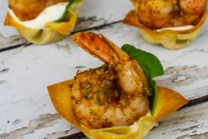 Shrimp Wonton Cups with Cajun Spice and basil leaves.