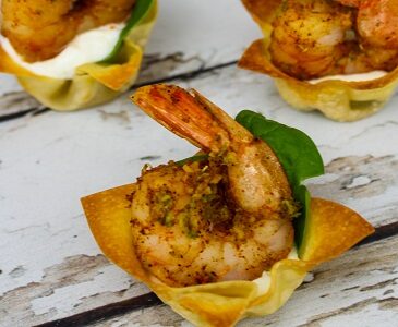 Shrimp Wonton Cups with Cajun Spice and basil leaves.