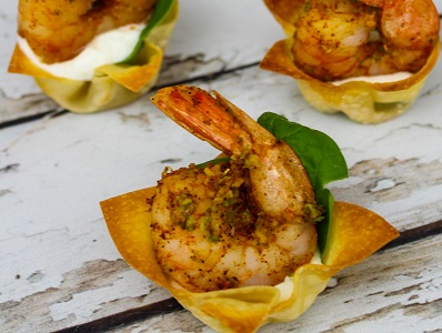 Shrimp Wonton Cups with Cajun Spice and basil leaves.