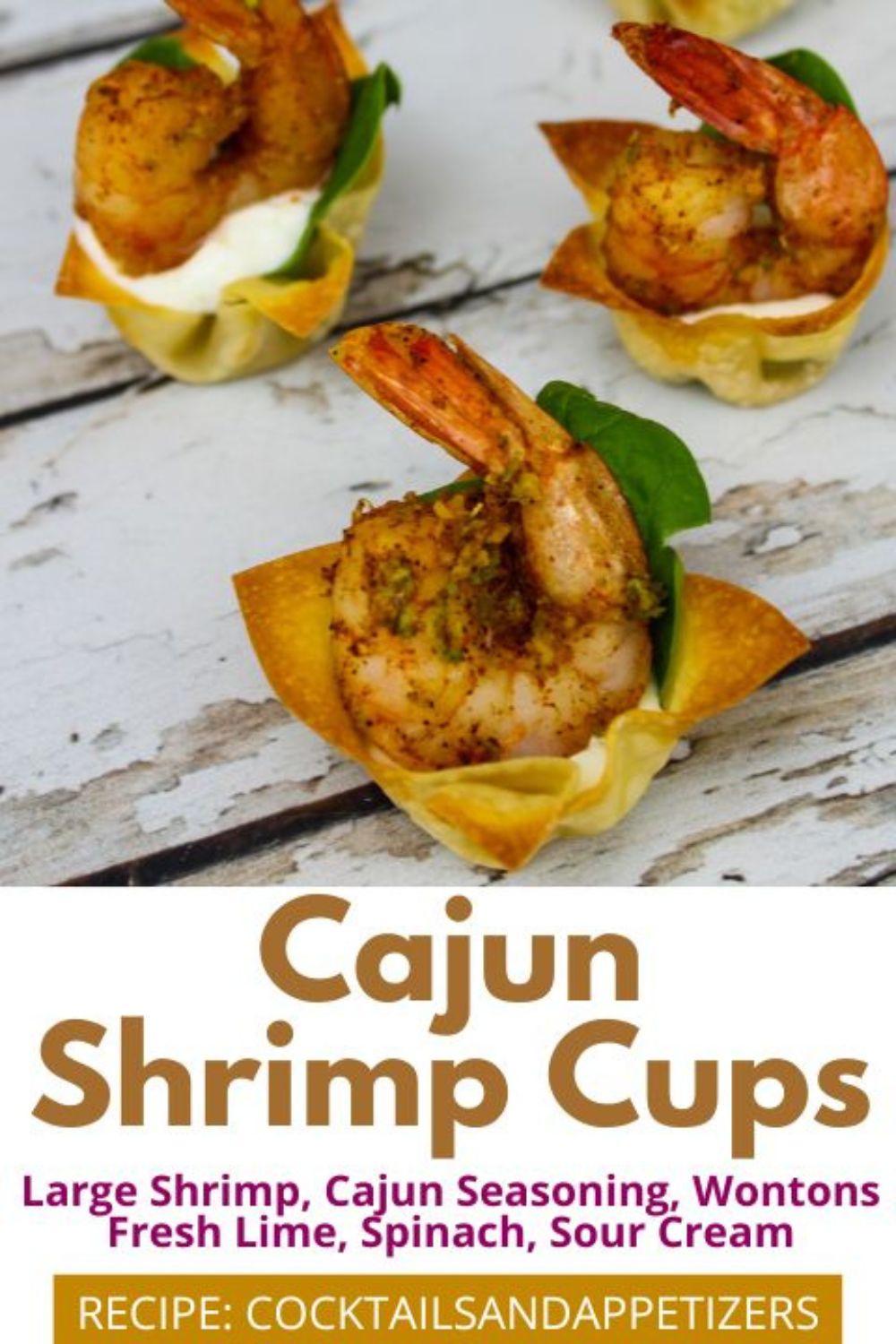 Cajun Shrimp Wonton Cups with baby spinach on a table.