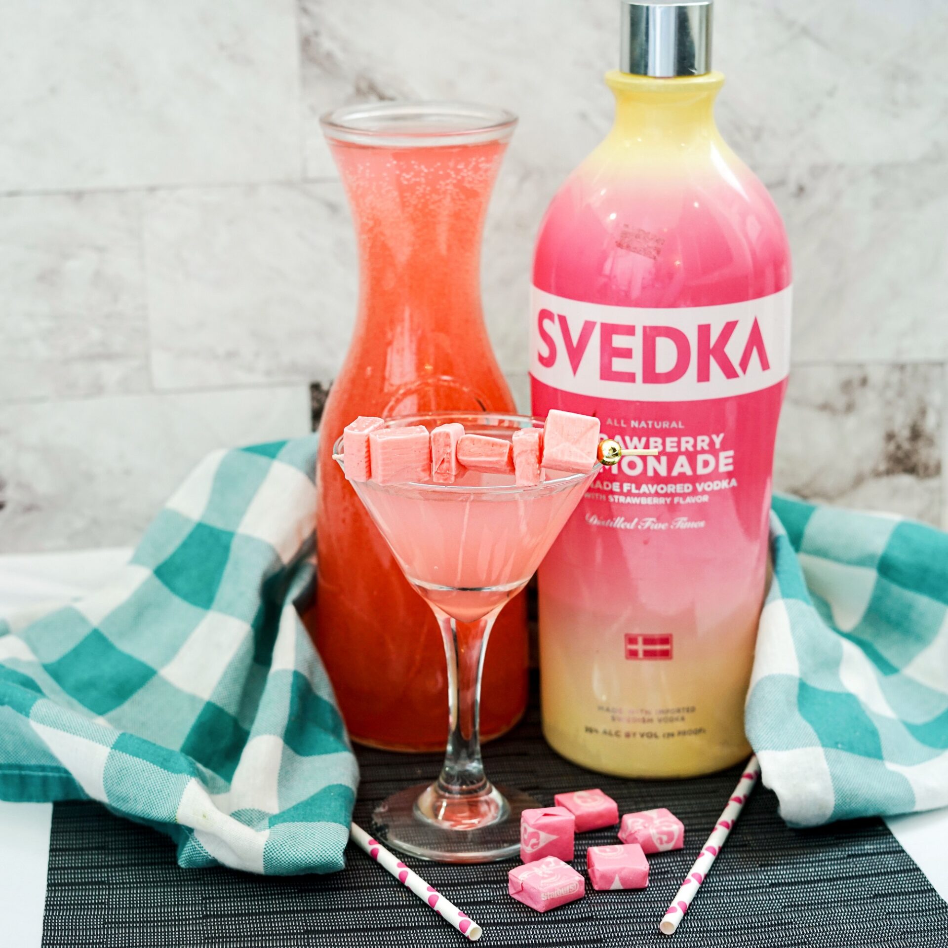 Strawberry lemonade vodka starburst cocktail on a counter.