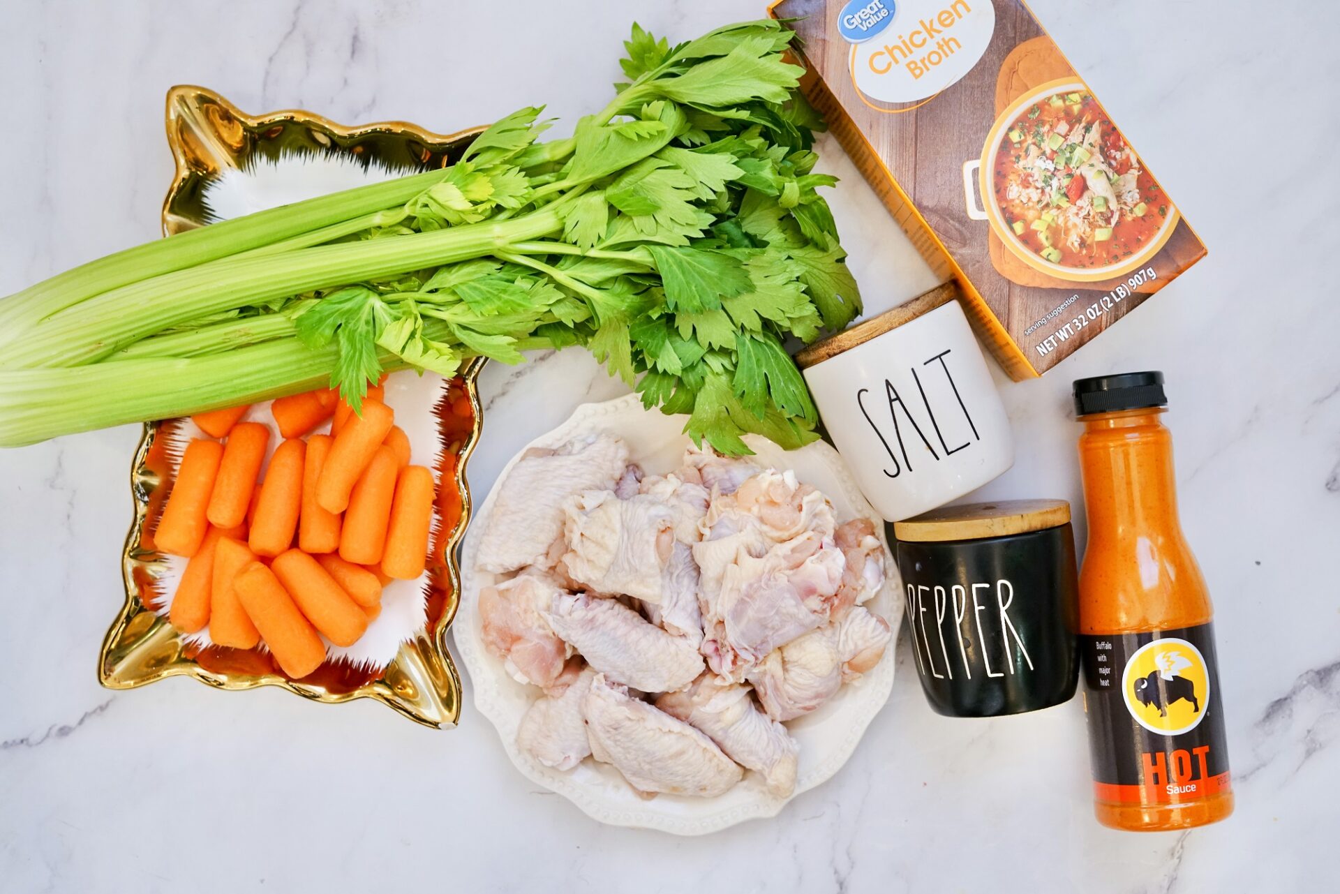Ingredients for instant pot buffalo wings on a counter.