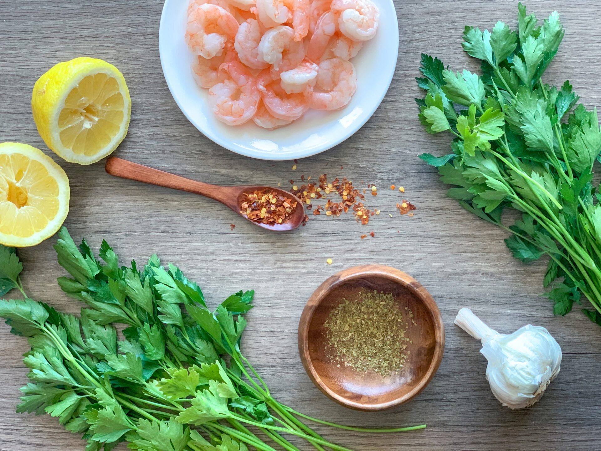 Ingredients for chimichurri shrimp on a counter.