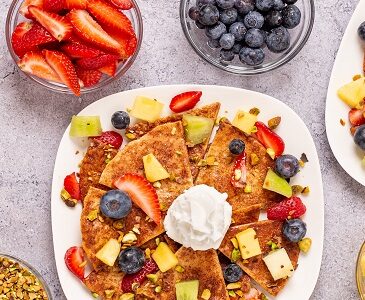 Dessert Nachos with cinnamon and fruit berries on a plate