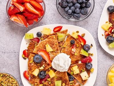 Dessert Nachos with cinnamon and fruit berries on a plate