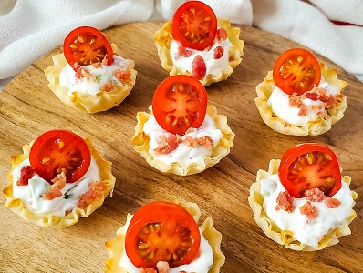 BLT Bites in phyllo shells with cherry tomato garnish