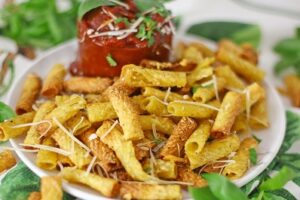 Air Fryer Pasta Chips on a plate with dipping sauce