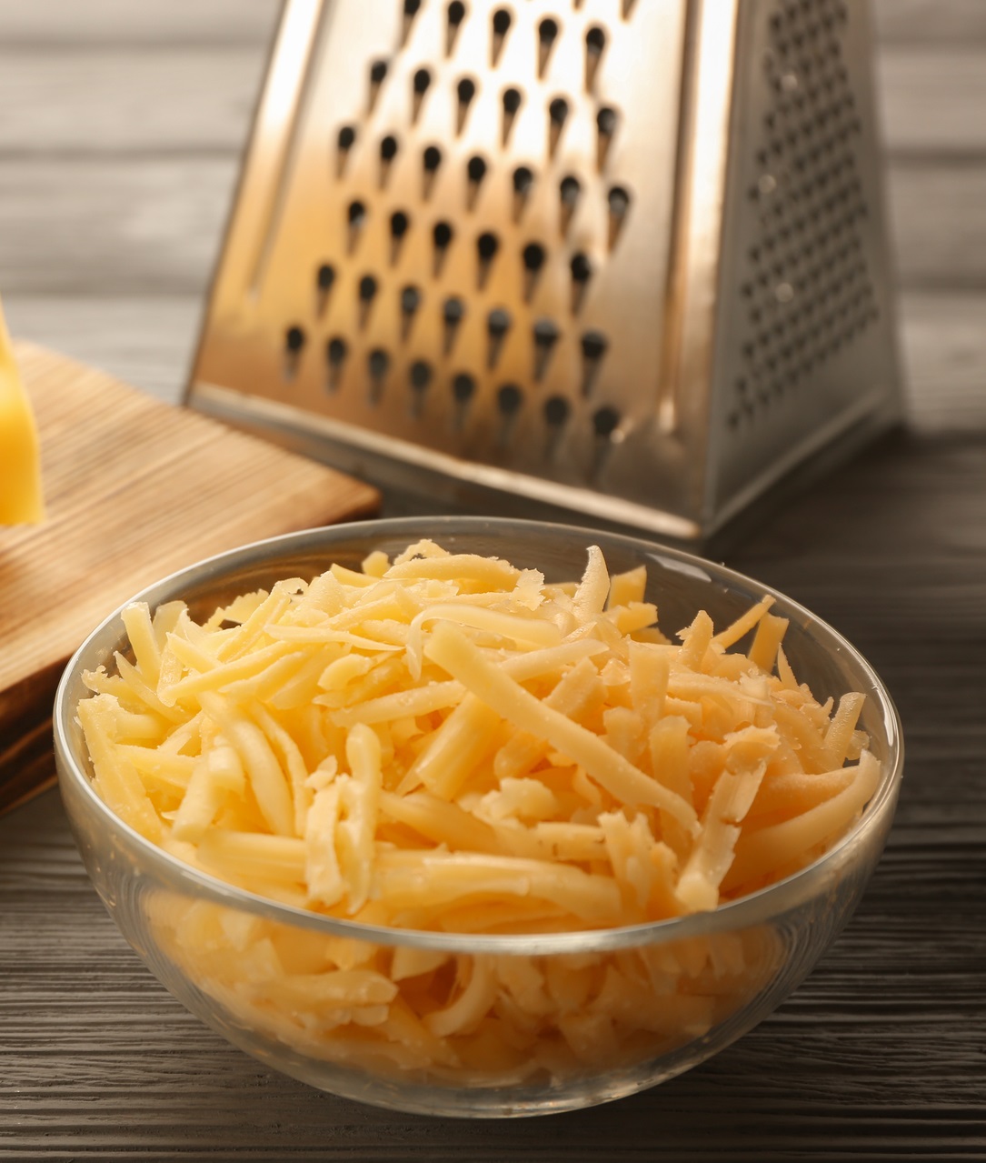 Grated cheese in a glass bowl.