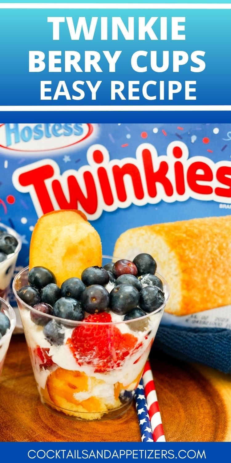 Twinkie berry cups on a wood slab with a box of Hostess Twinkies behind them