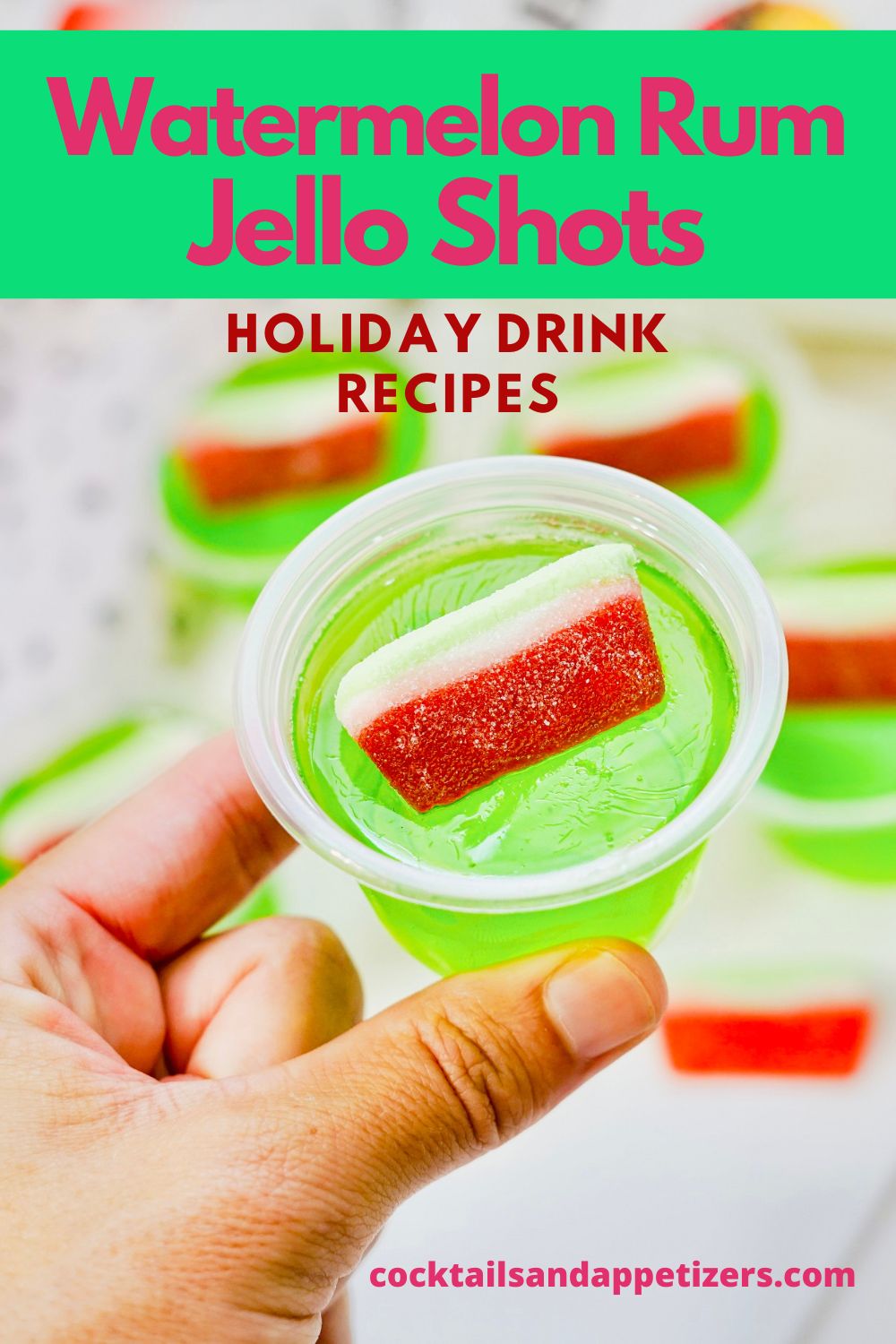 Jello shots with Malibu Rum in a condiment cup with a candy garnish.