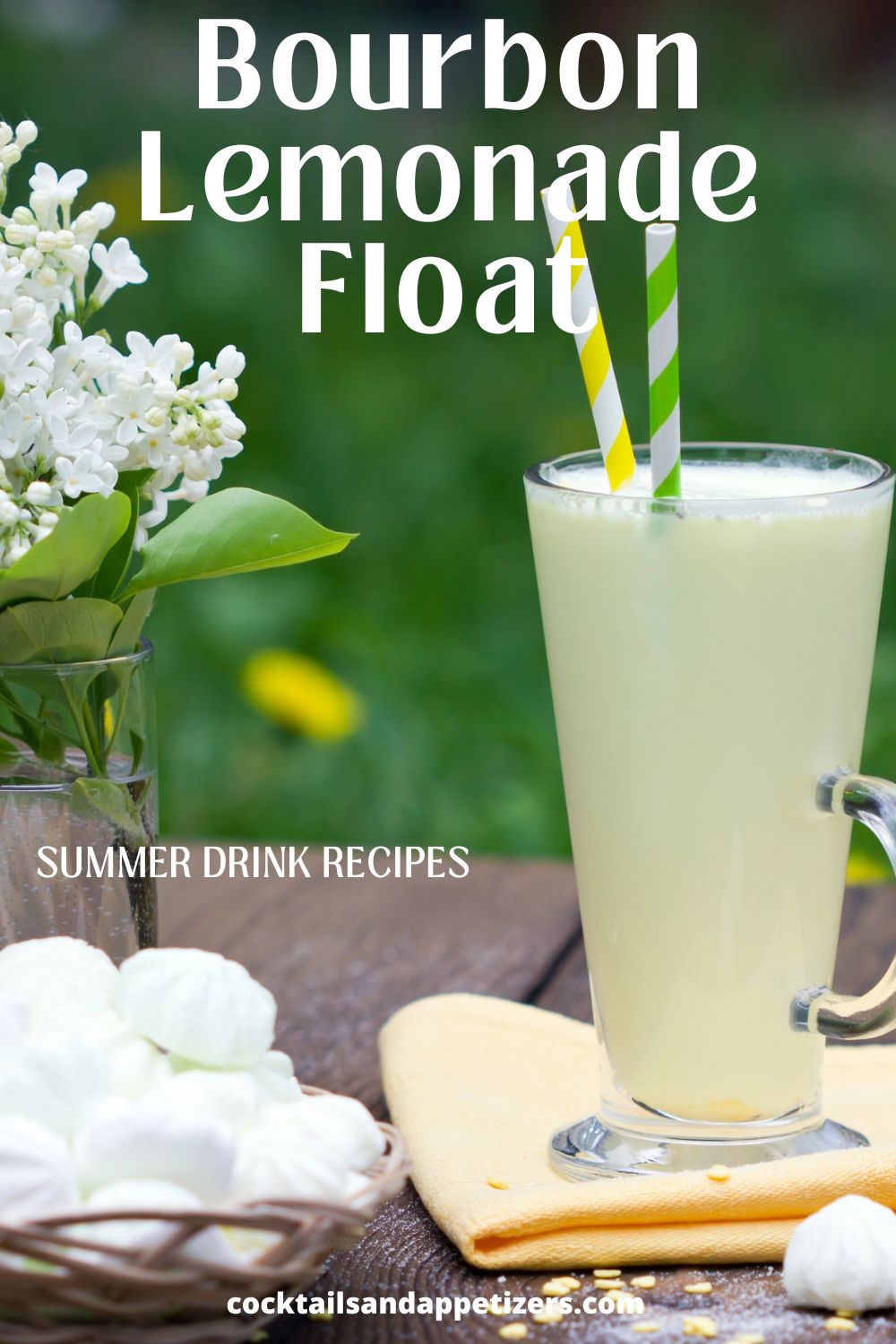 Bourbon Lemonade ice cream float in a tall glass with straws, sitting on a wood table outside.
