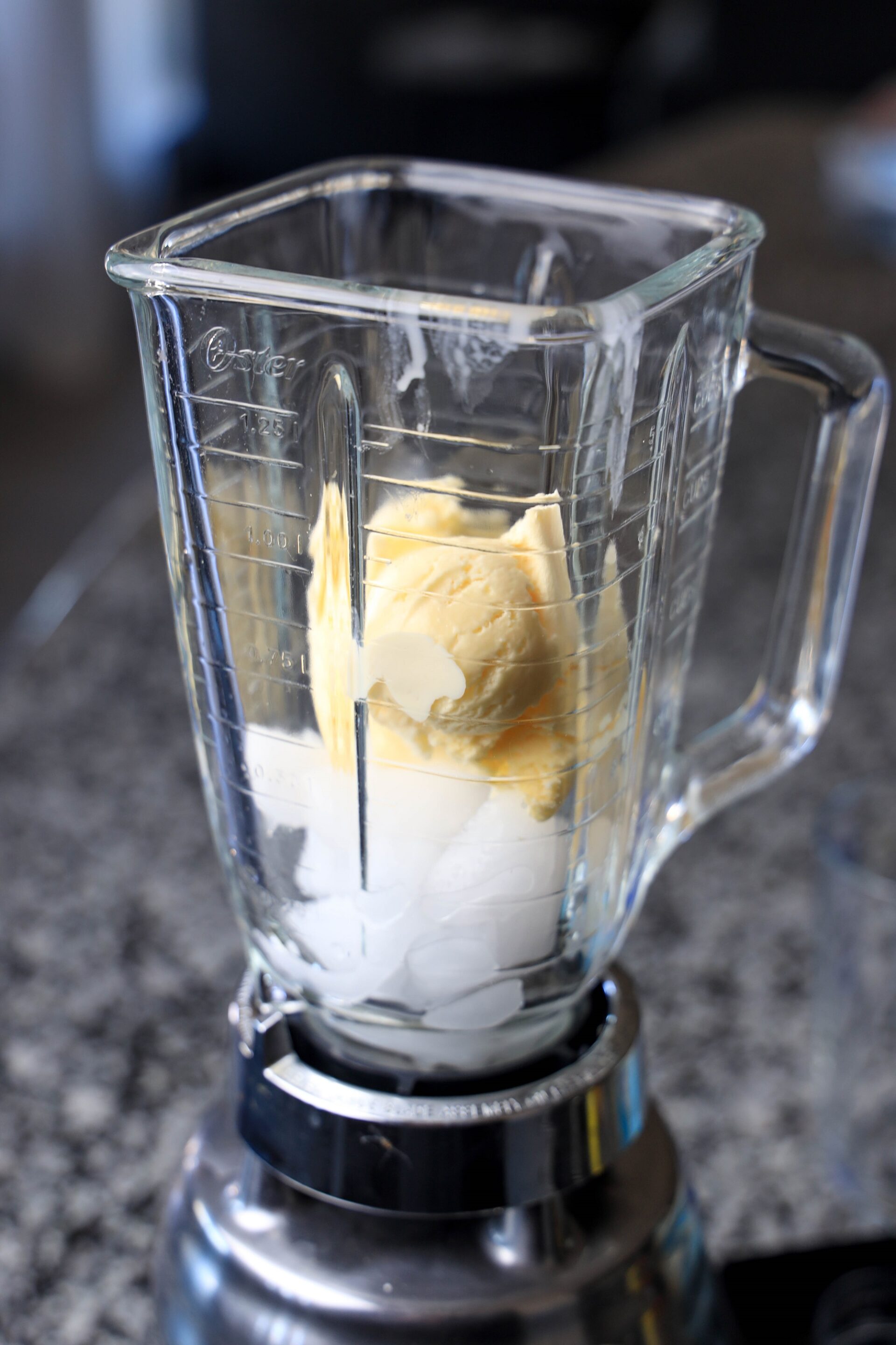 Ice cream and ice cubes in a blender.