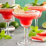 Best margarita recipes including these strawberry margaritas in glasses with fresh mint garnish.