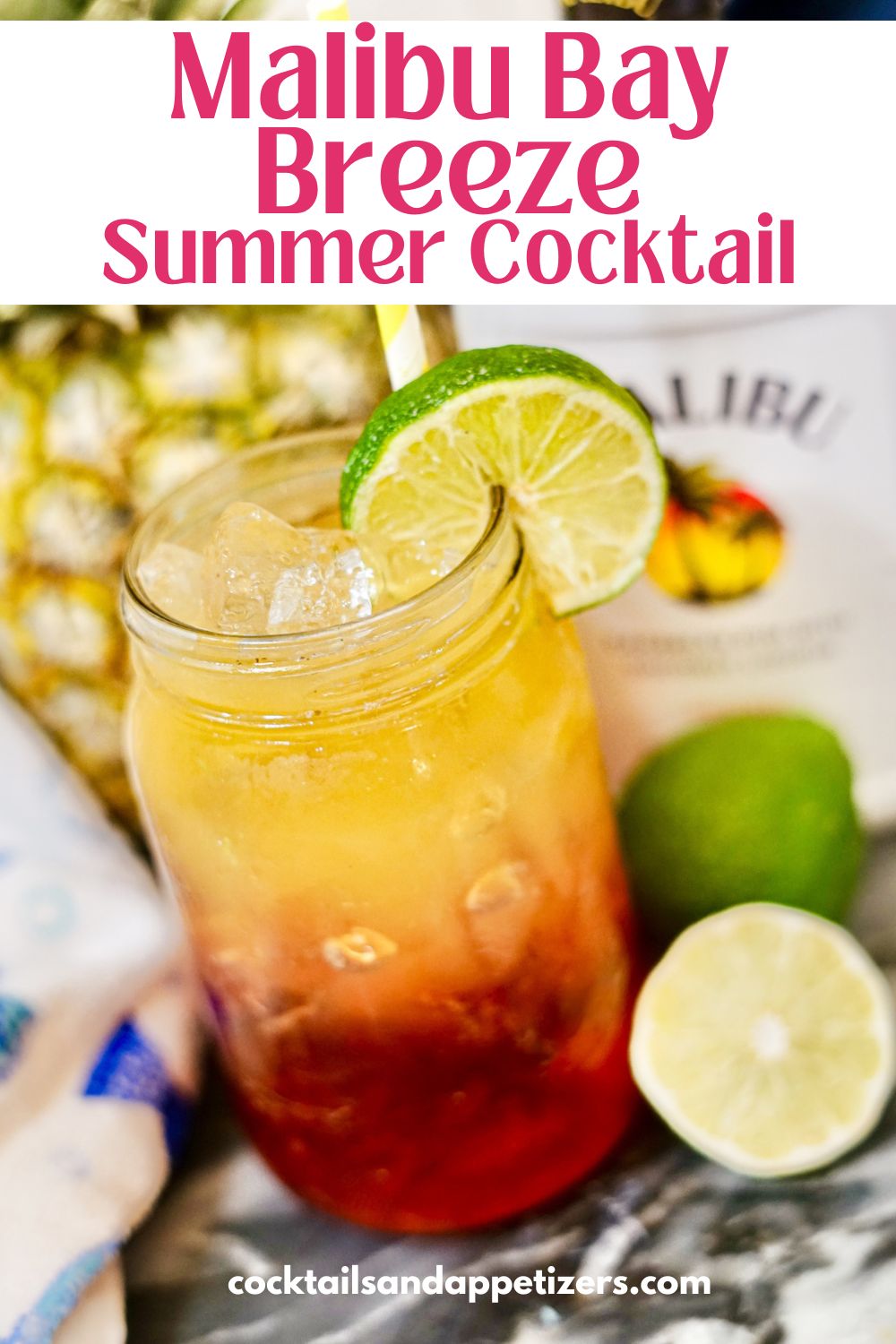 Malibu Bay Breeze cocktail in a mason jar glass with lime garnish.