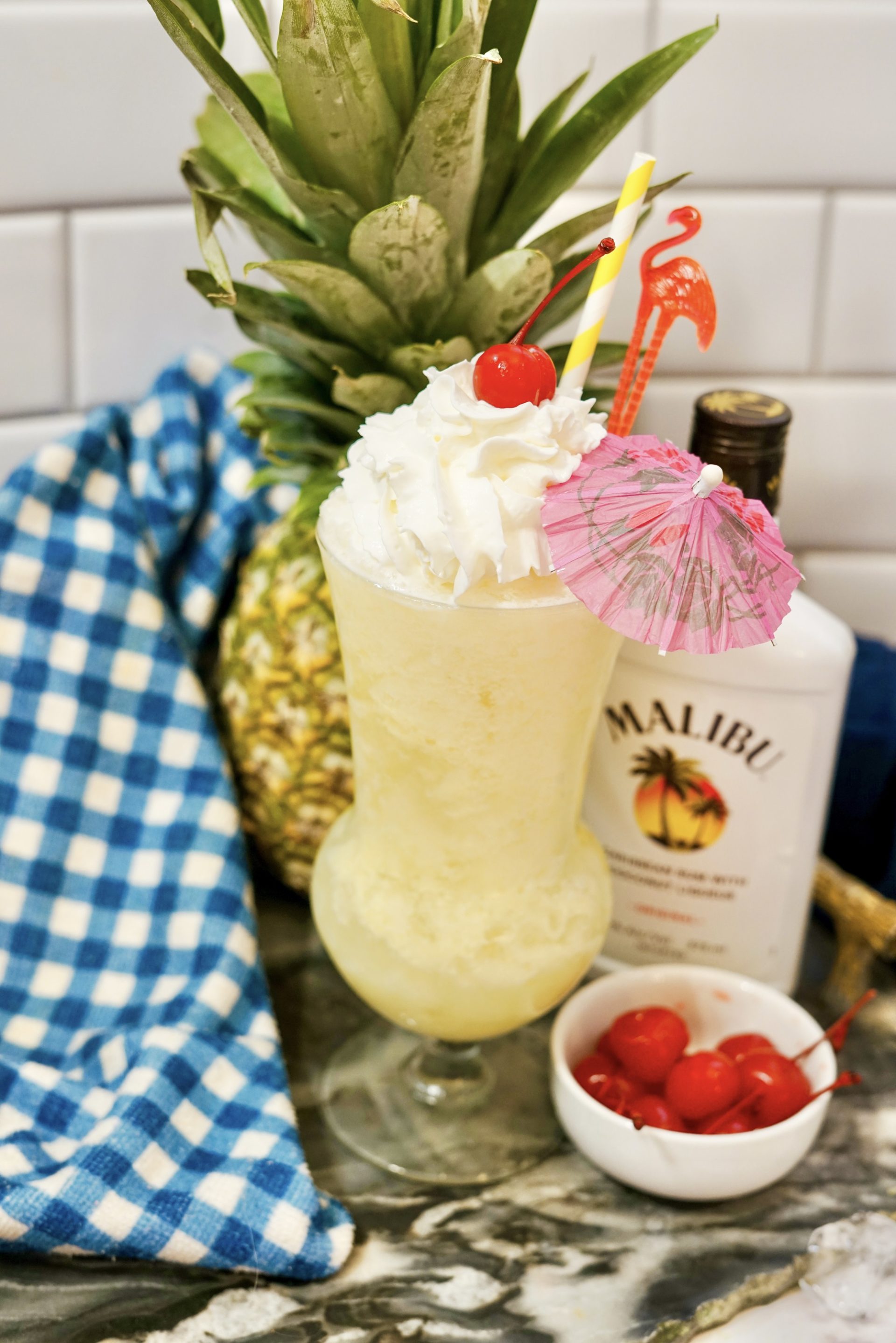 Malibu pina colada on a counter with ingredients.