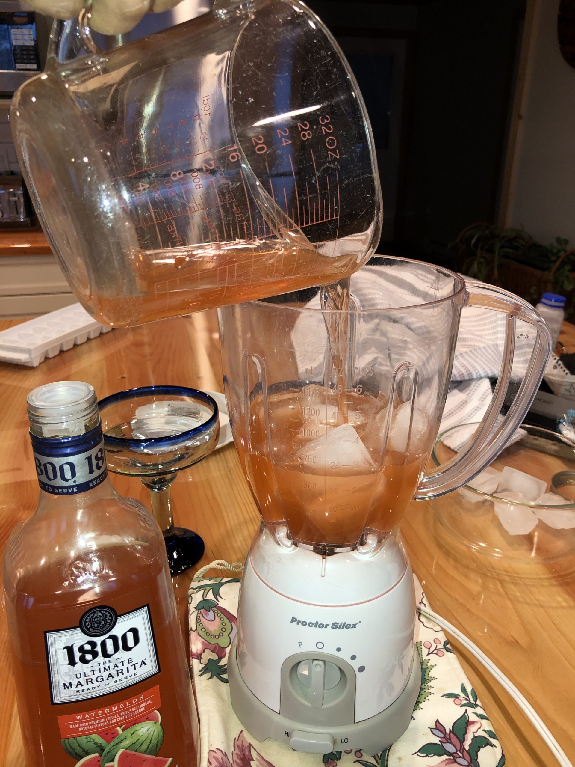 Adding 1800 Ultimate Margarita Watermelon to ice in blender